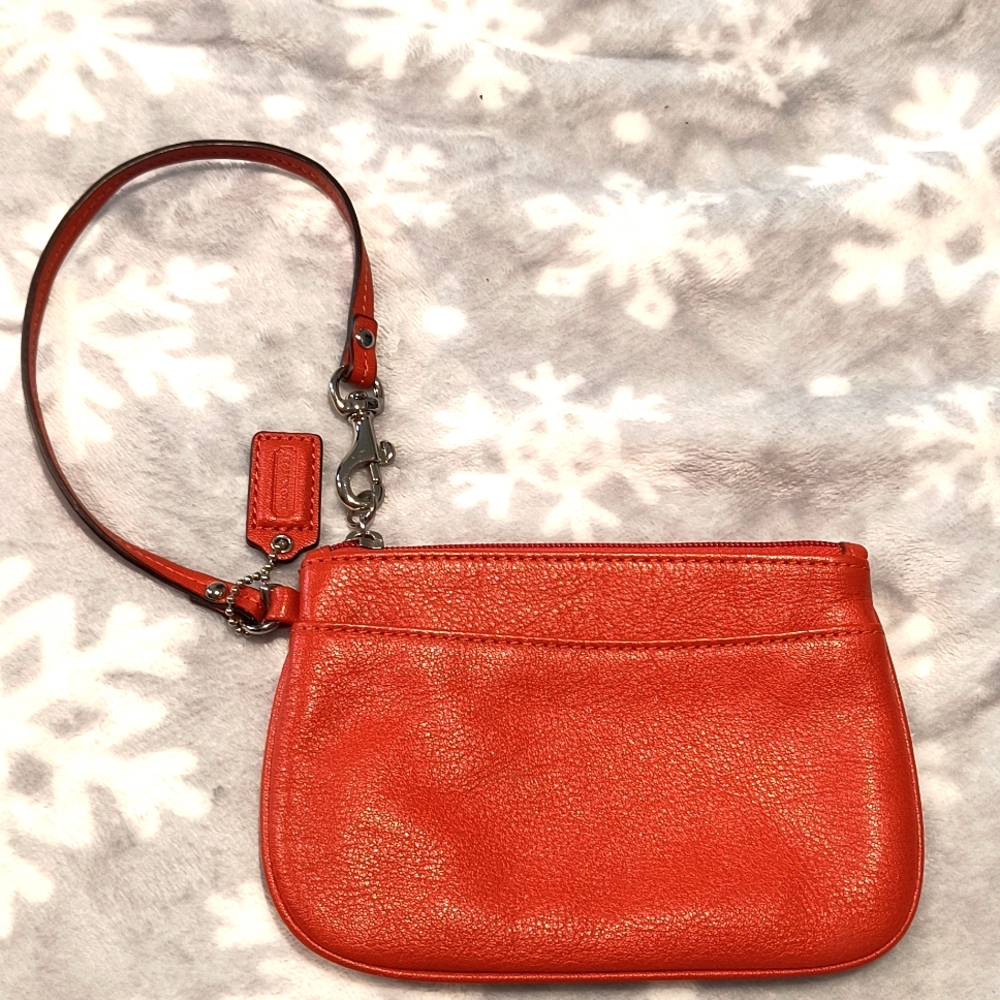 Coach Smooth Leather Wristlet in a  burnt Tangerine orange. Flawless  EUC